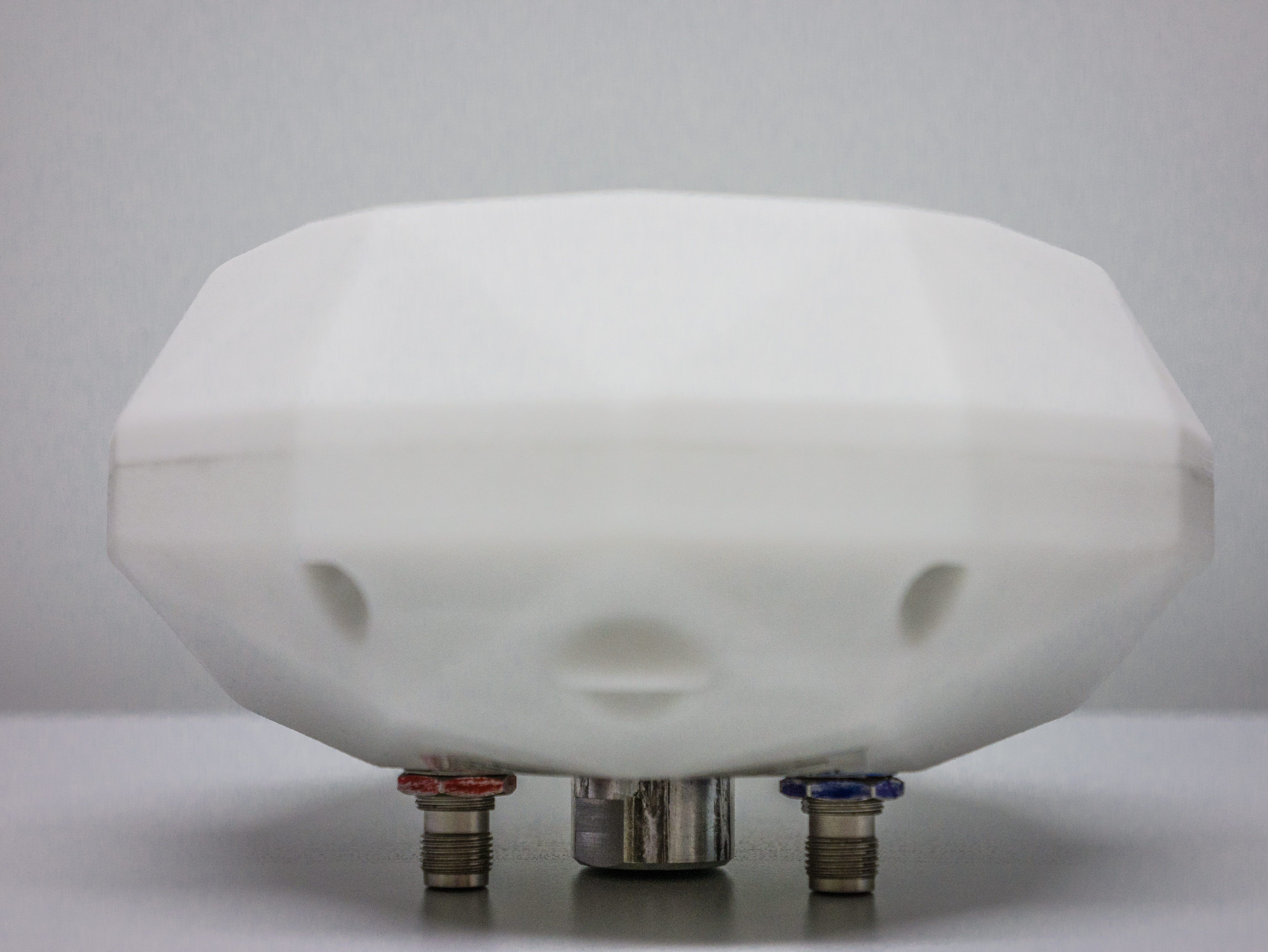 TeleOrbit's GNSSA-DCP (dual-circularly polarized (RHCP & LHCP)) antenna shown in its 3D-printed white housing.